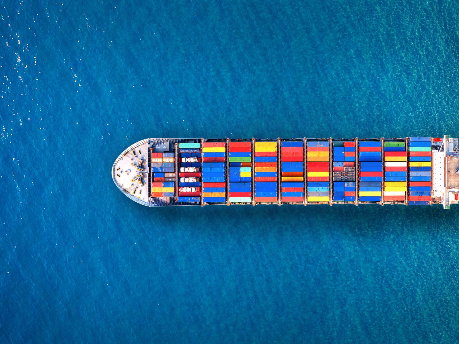 Aerial view of container cargo ship in sea.